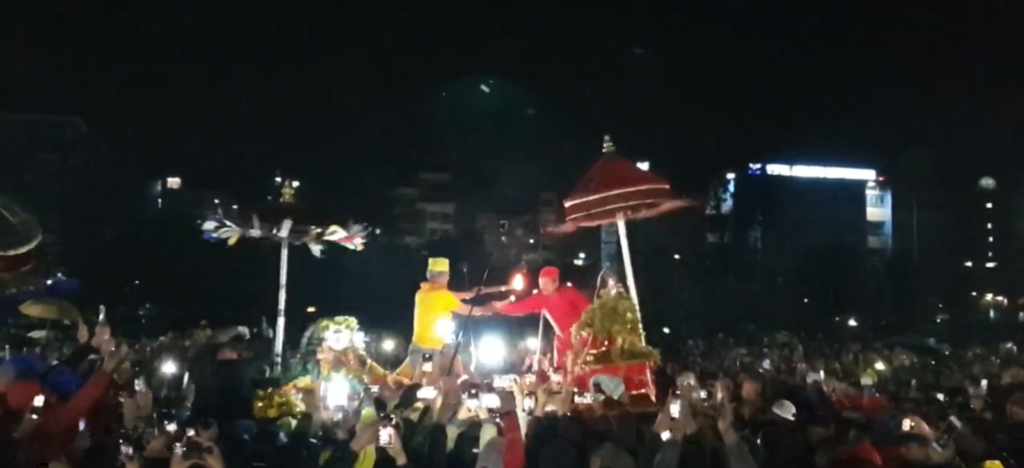 Dyah Lwākegu: Meeting of three sisters and exchange of chilaag (fire torch) at Tundikhel Chilaag exchange between Tebahal Ajima (yellow) and Kanga Ajima (red) at Tundikhel.