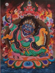 Mahakala Bernagchen in a fierce form holding a curved flaying knife (kartika) with a vajra handle on his right and lood-filled skull cup (kapala) on his left.